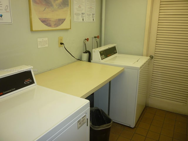 washroom featuring tile floors and washing machine and clothes dryer