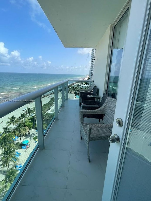 balcony featuring a water view