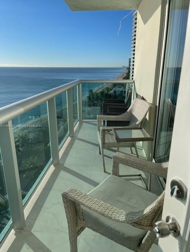 balcony featuring a water view