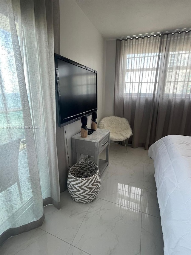 bedroom with light tile floors