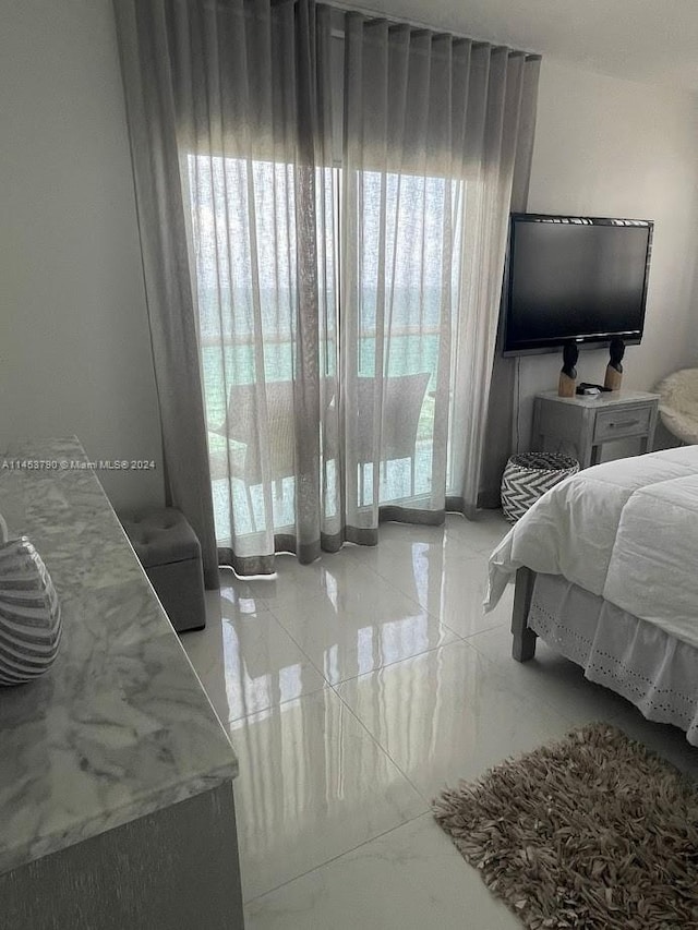 bedroom featuring light tile flooring