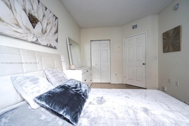 bedroom featuring light carpet and a closet