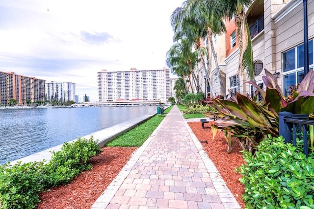 surrounding community featuring a water view