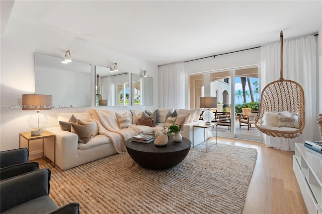 living room featuring light hardwood / wood-style floors and plenty of natural light