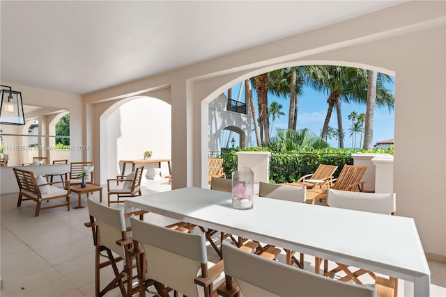 dining space with light tile floors