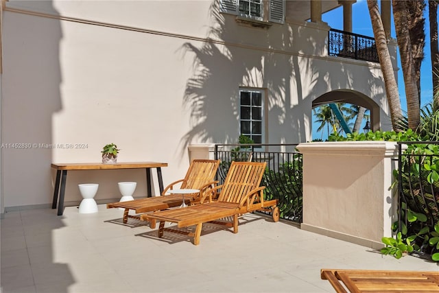 view of patio featuring a balcony