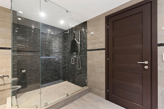 bathroom featuring walk in shower and toilet