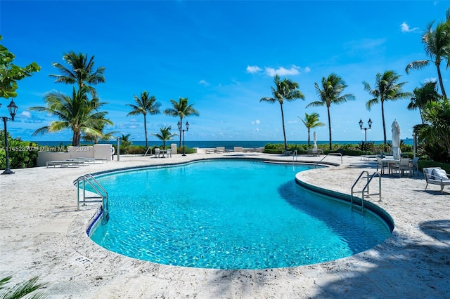 view of swimming pool with a patio area