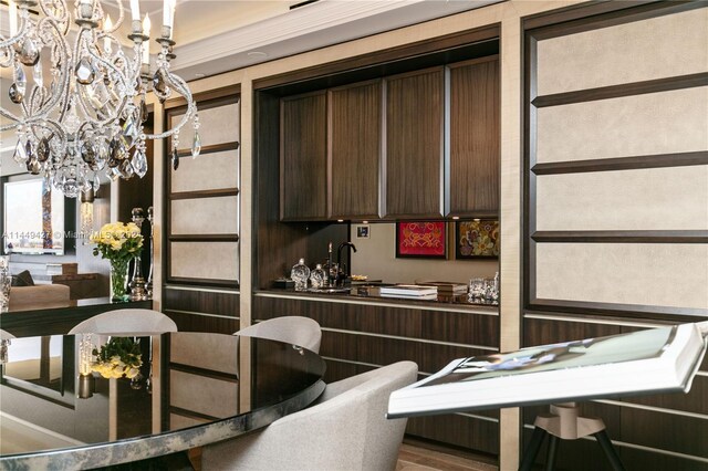 9705 Collins Ave Unit 1803N, Bal Harbour, FL 33154 - kitchen featuring a chandelier and dark brown cabinets