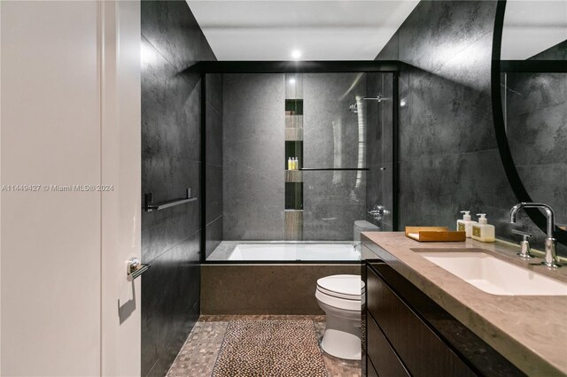 9705 Collins Ave Unit 1803N, Bal Harbour, FL 33154 - bathroom featuring toilet, vanity, and shower / bath combination