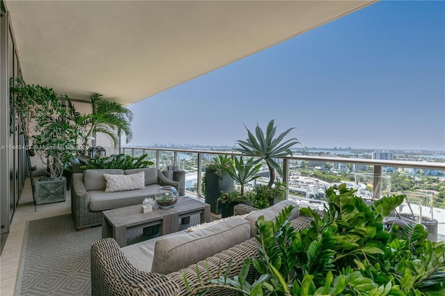 balcony with a water view and outdoor lounge area