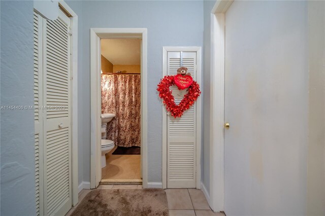 interior space featuring light tile floors