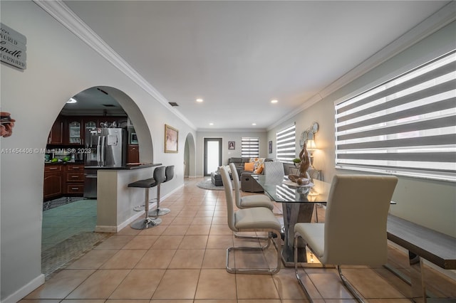 tiled dining area with crown molding