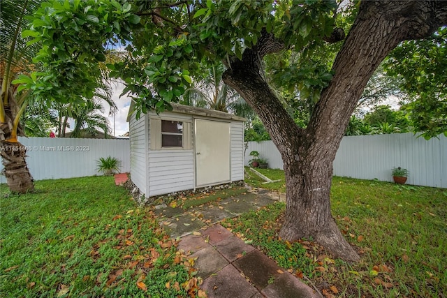 view of shed / structure with a lawn