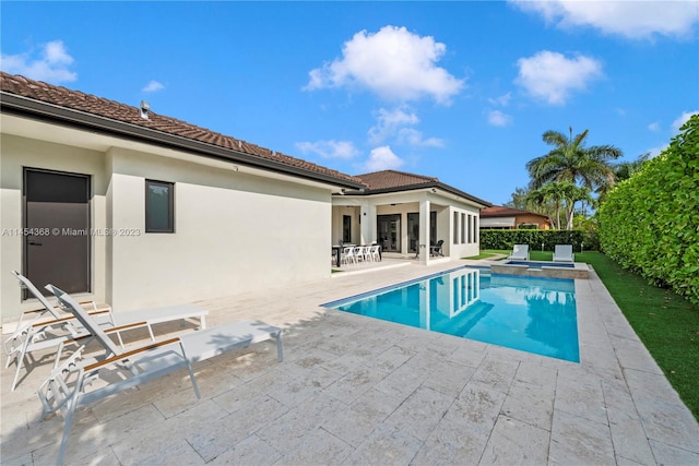 view of swimming pool with a patio