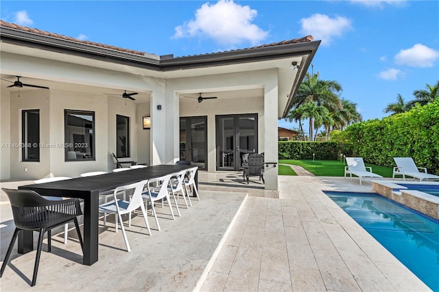 back of house with a patio, ceiling fan, and a fenced in pool