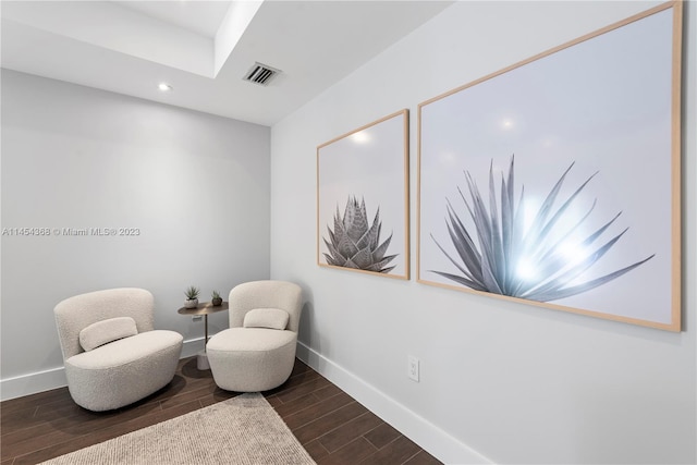 sitting room with dark hardwood / wood-style floors