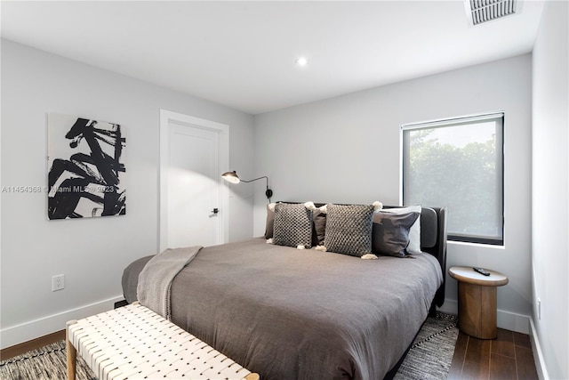 bedroom featuring dark hardwood / wood-style flooring