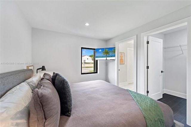 bedroom featuring a closet and dark wood-type flooring