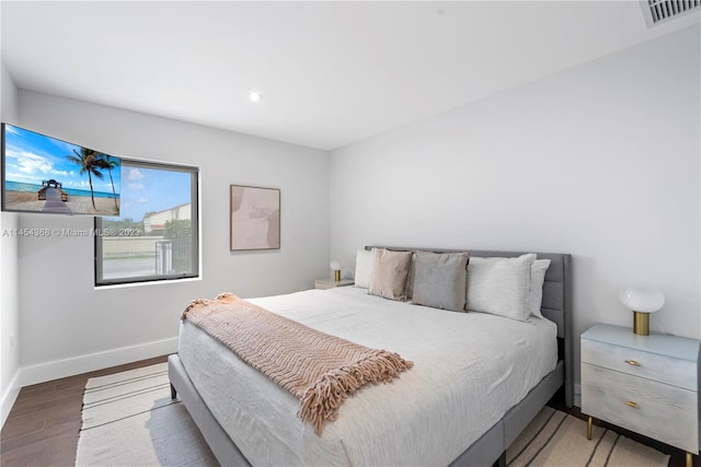 bedroom with hardwood / wood-style flooring