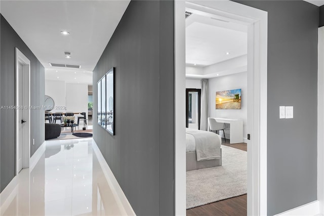 corridor with light hardwood / wood-style flooring