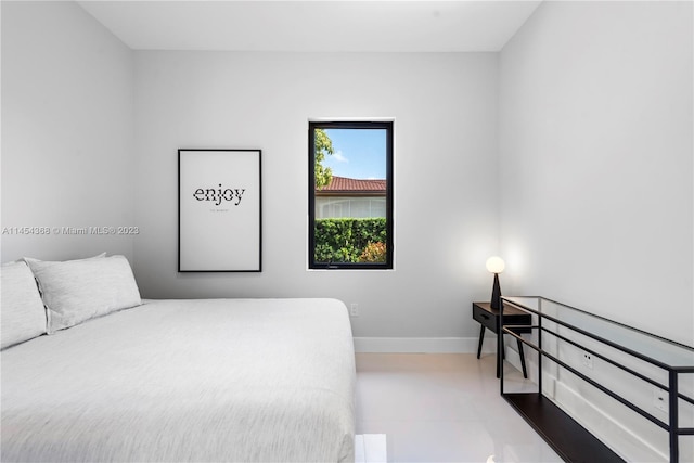 bedroom with light tile floors