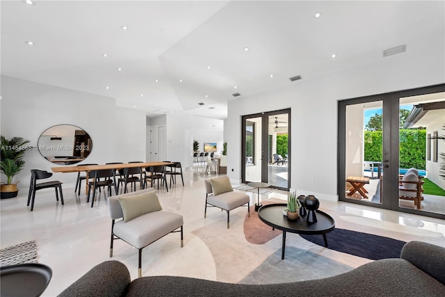 living room featuring light tile flooring and french doors