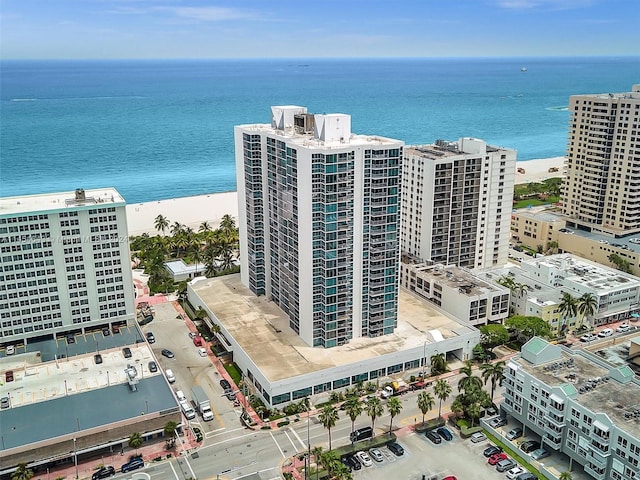 bird's eye view featuring a water view and a view of the beach