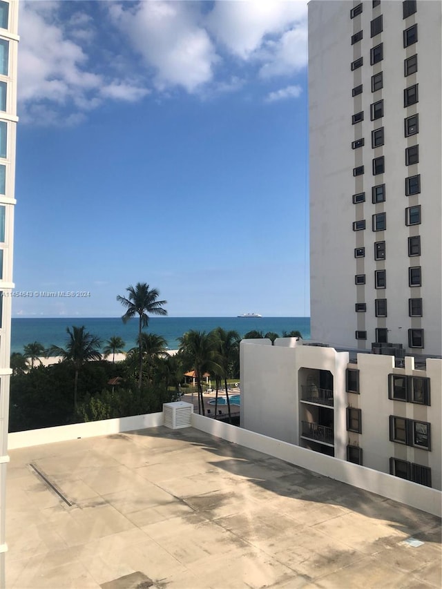 view of patio with a water view