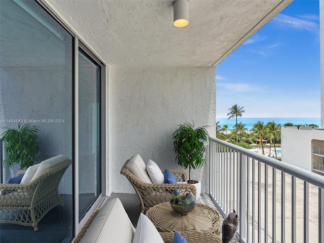 balcony featuring a water view