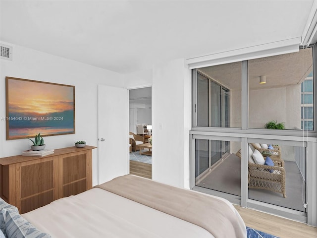 bedroom featuring hardwood / wood-style floors