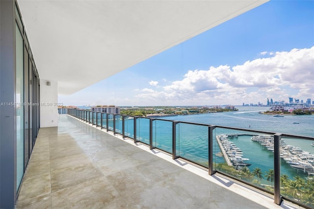 balcony featuring a water view