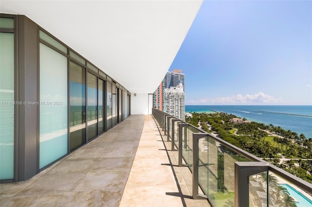 balcony featuring a water view