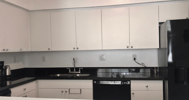 kitchen featuring sink, white cabinets, and black appliances