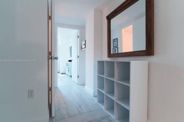 hall with light wood-type flooring