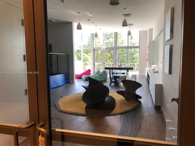 16385 Biscayne Blvd Unit 1417, North Miami Beach, FL 33160 - dining area featuring floor to ceiling windows and hardwood / wood-style flooring