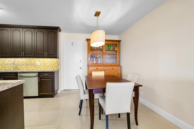 tiled dining room with sink