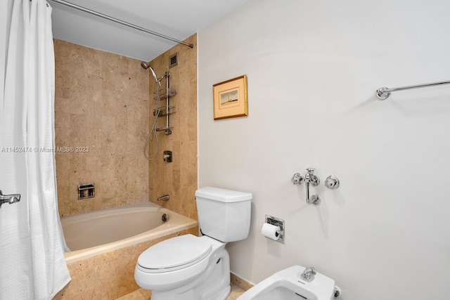 bathroom featuring a bidet, shower / bath combination with curtain, and toilet