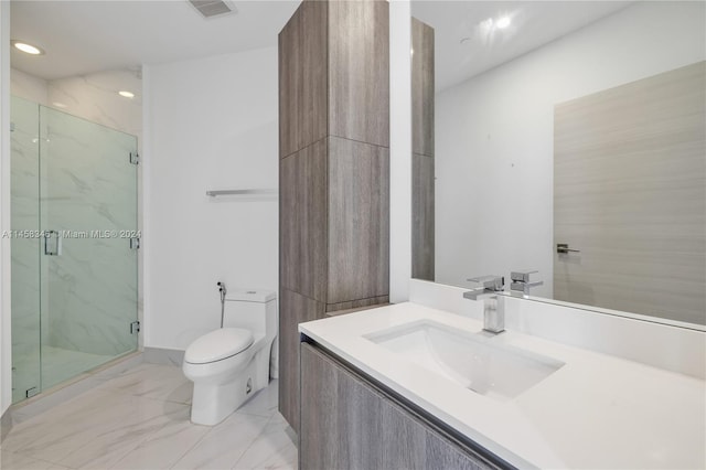 bathroom with a shower with door, tile floors, oversized vanity, and toilet