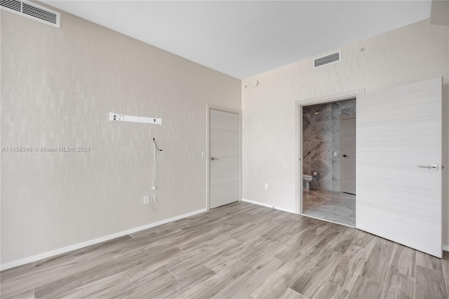 unfurnished room featuring light hardwood / wood-style floors