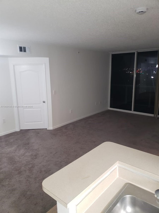 interior space featuring a textured ceiling