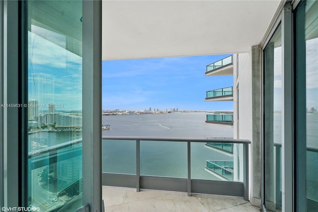 balcony featuring a water view