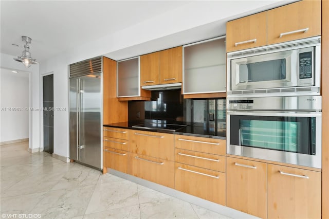 kitchen with backsplash and built in appliances