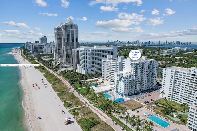 aerial view featuring a view of the beach and a water view