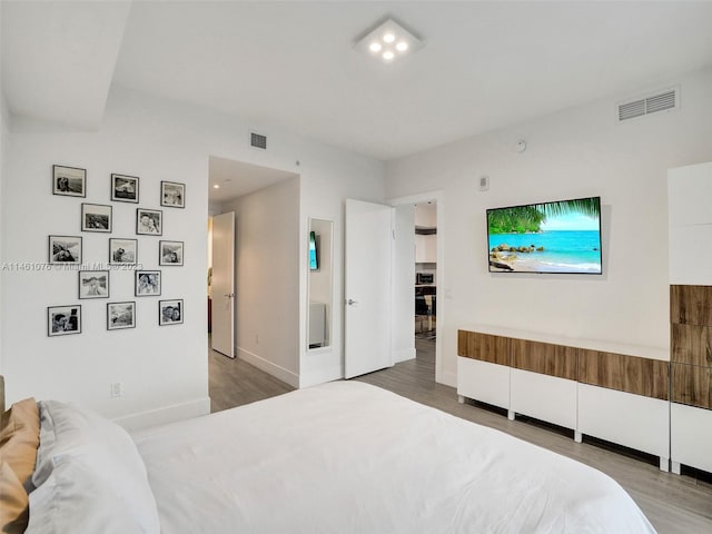 bedroom featuring hardwood / wood-style floors