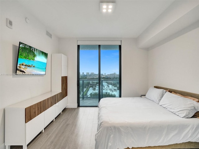 bedroom with light hardwood / wood-style floors