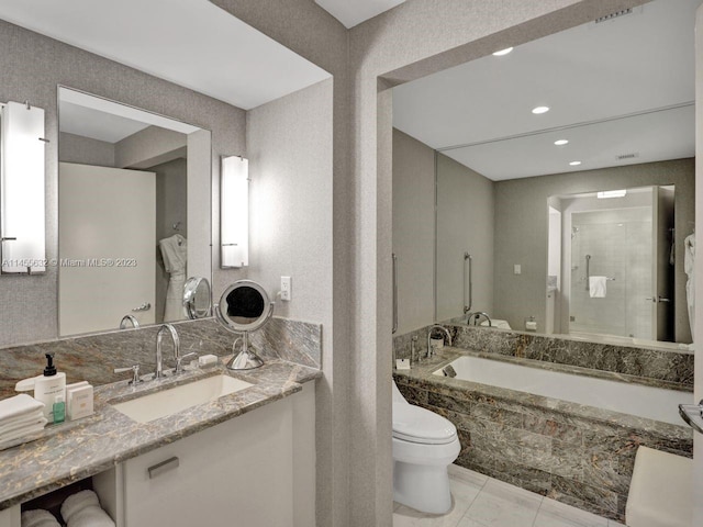 full bathroom featuring tile flooring, oversized vanity, toilet, and separate shower and tub