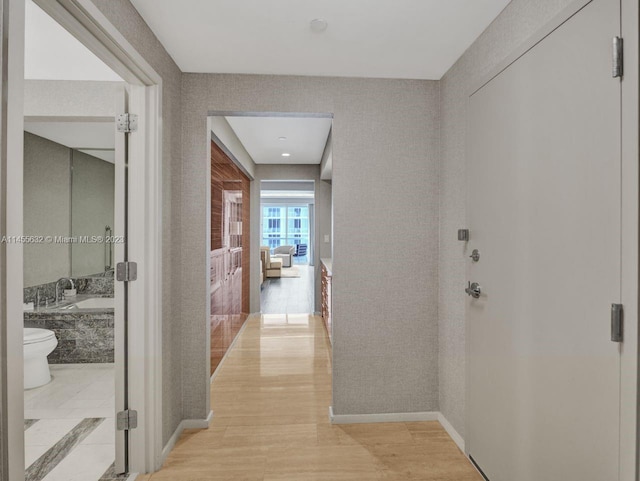 hall with light tile flooring