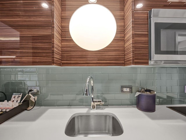 kitchen featuring backsplash and sink