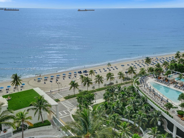 bird's eye view featuring a water view and a beach view